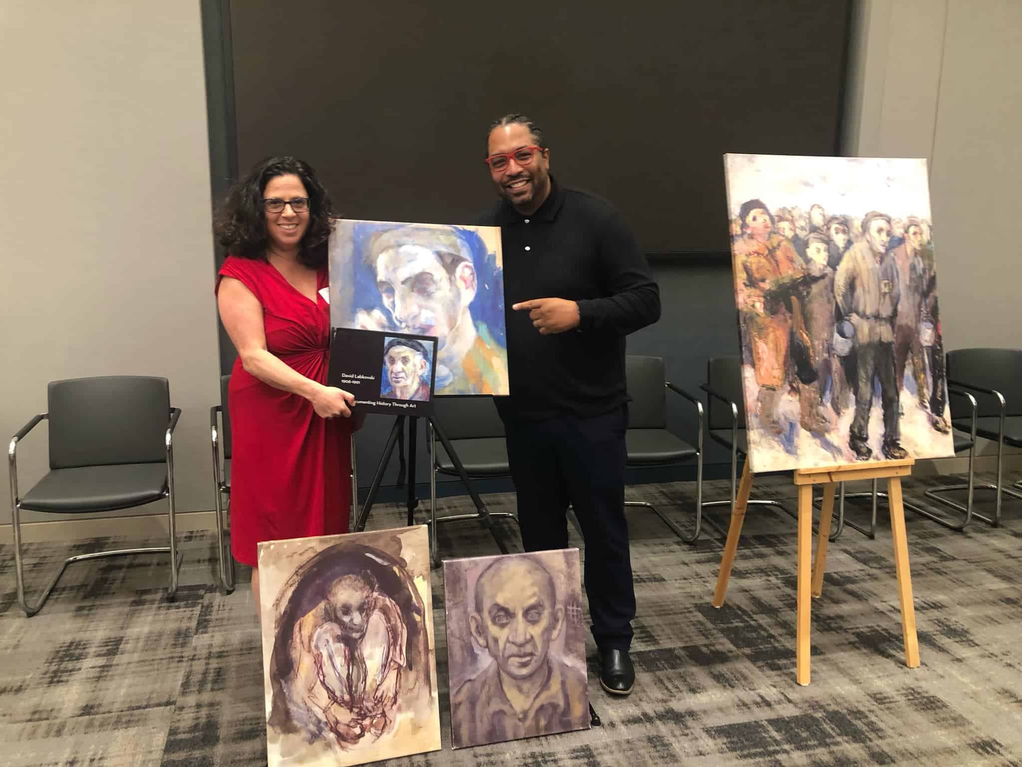 Leora Raikin and Darryl Pugh with a piece of David Labkovski's art at the Capital Group exhibit