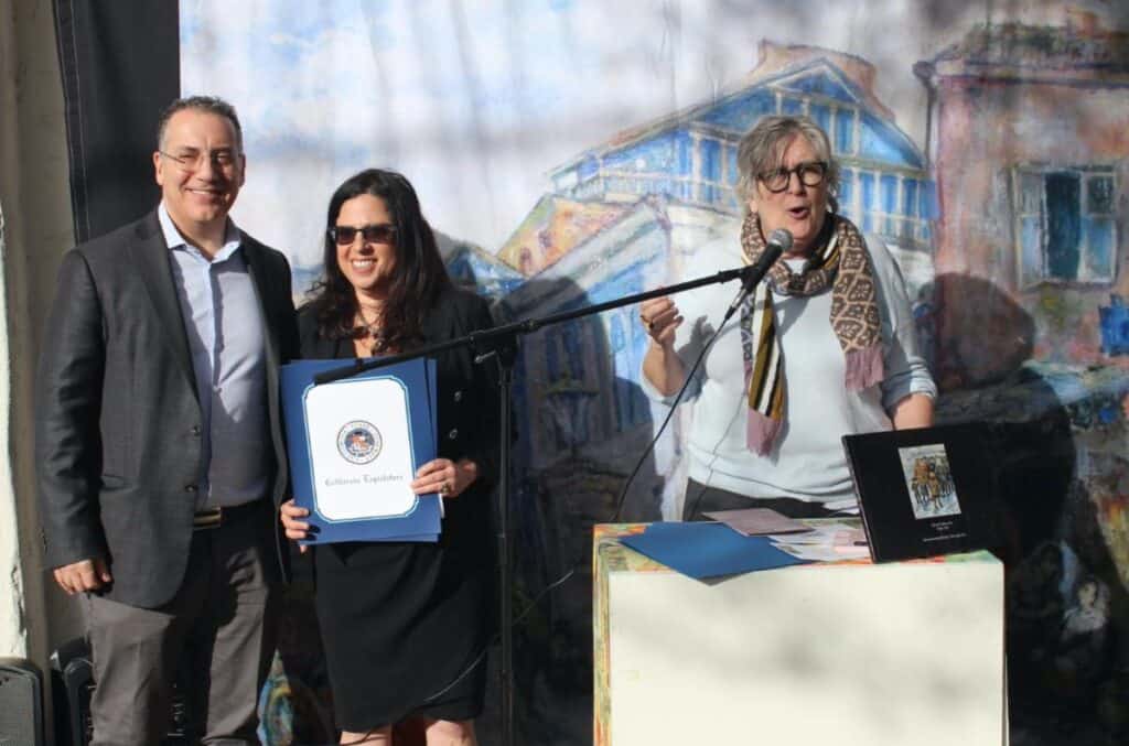 Los Angeles Councilmember Bob Blumenfield presenting resolution certificates to students.