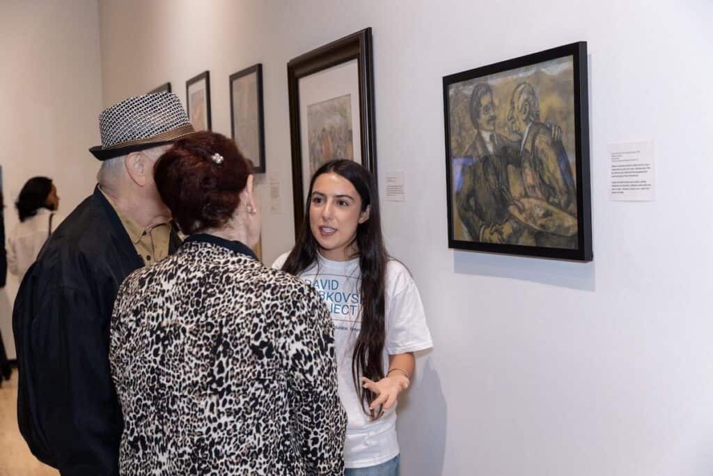 DLP Student docent at CSUN, where they led guests through the new traveling exhibit "Through the Eyes of David Labkovski"