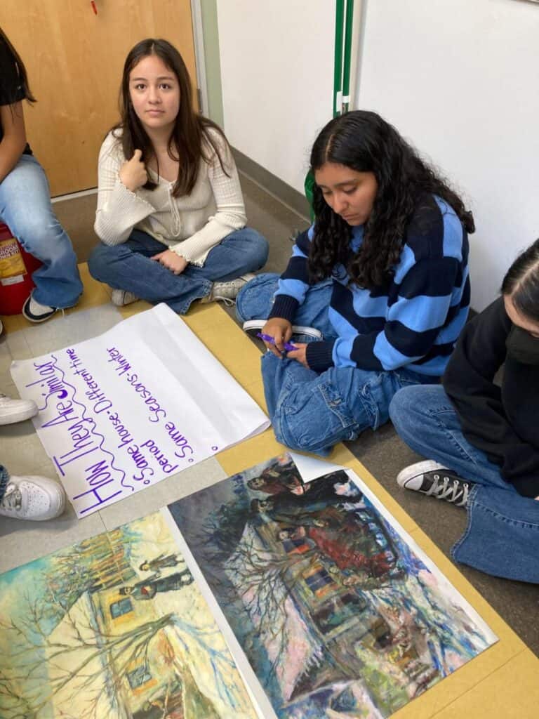 Students engaged in learning to critically “read” Labkovski’s narrative art. Painting shows DLP Founder Leora Raikin's great grandparents being forced from their home into the Vilna ghetto.